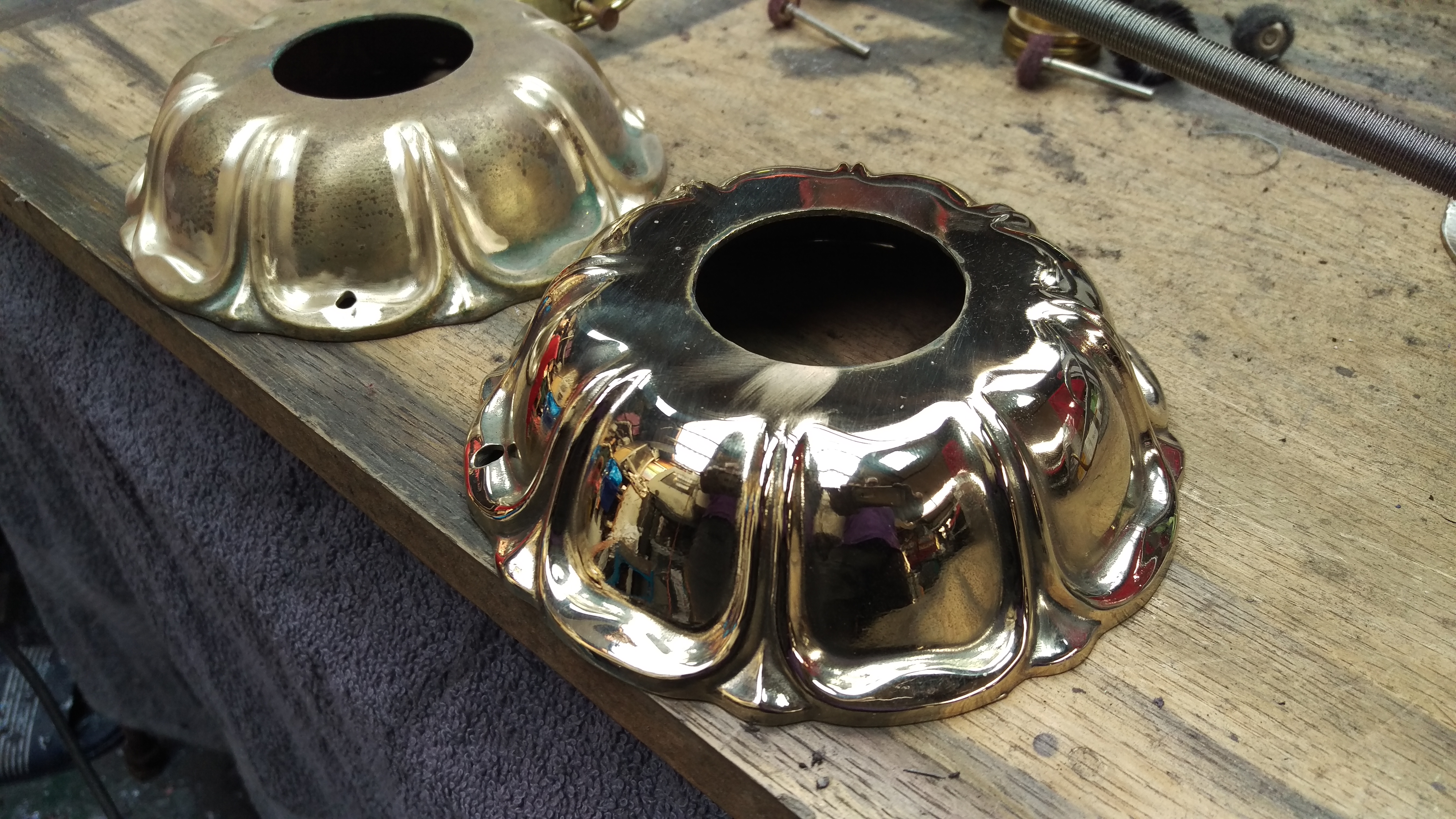 large cast brass ceiling roses being resurfaced after casting